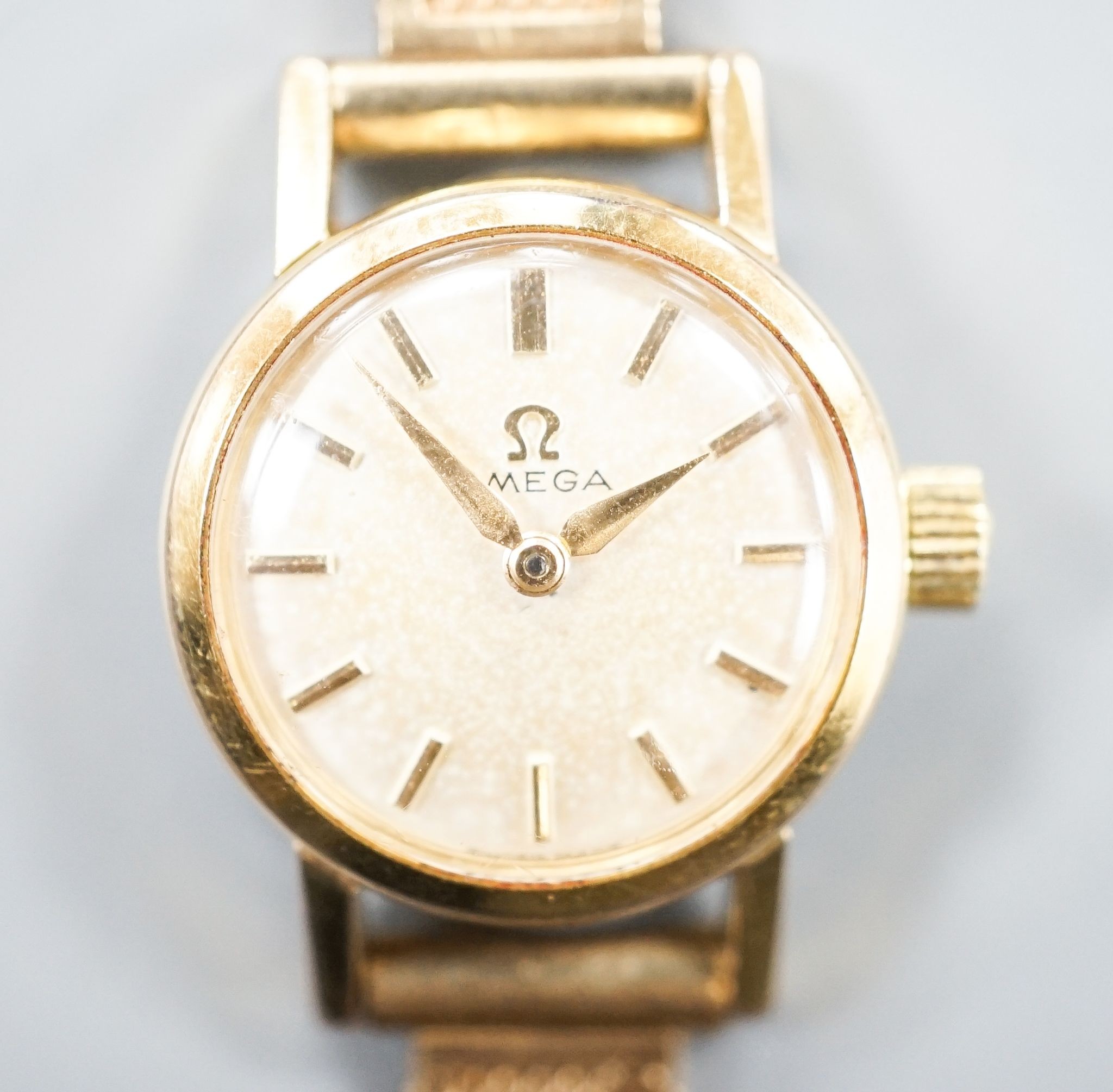 A lady's 1960's steel and gold plated Omega manual wind wrist watch, on an associated 9ct gold bracelet